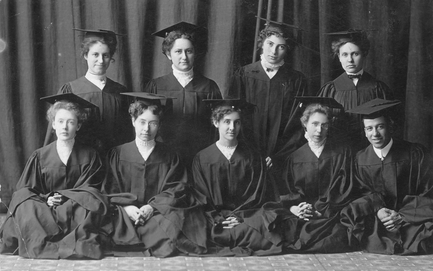Group of students in graduation robes and mortarboards