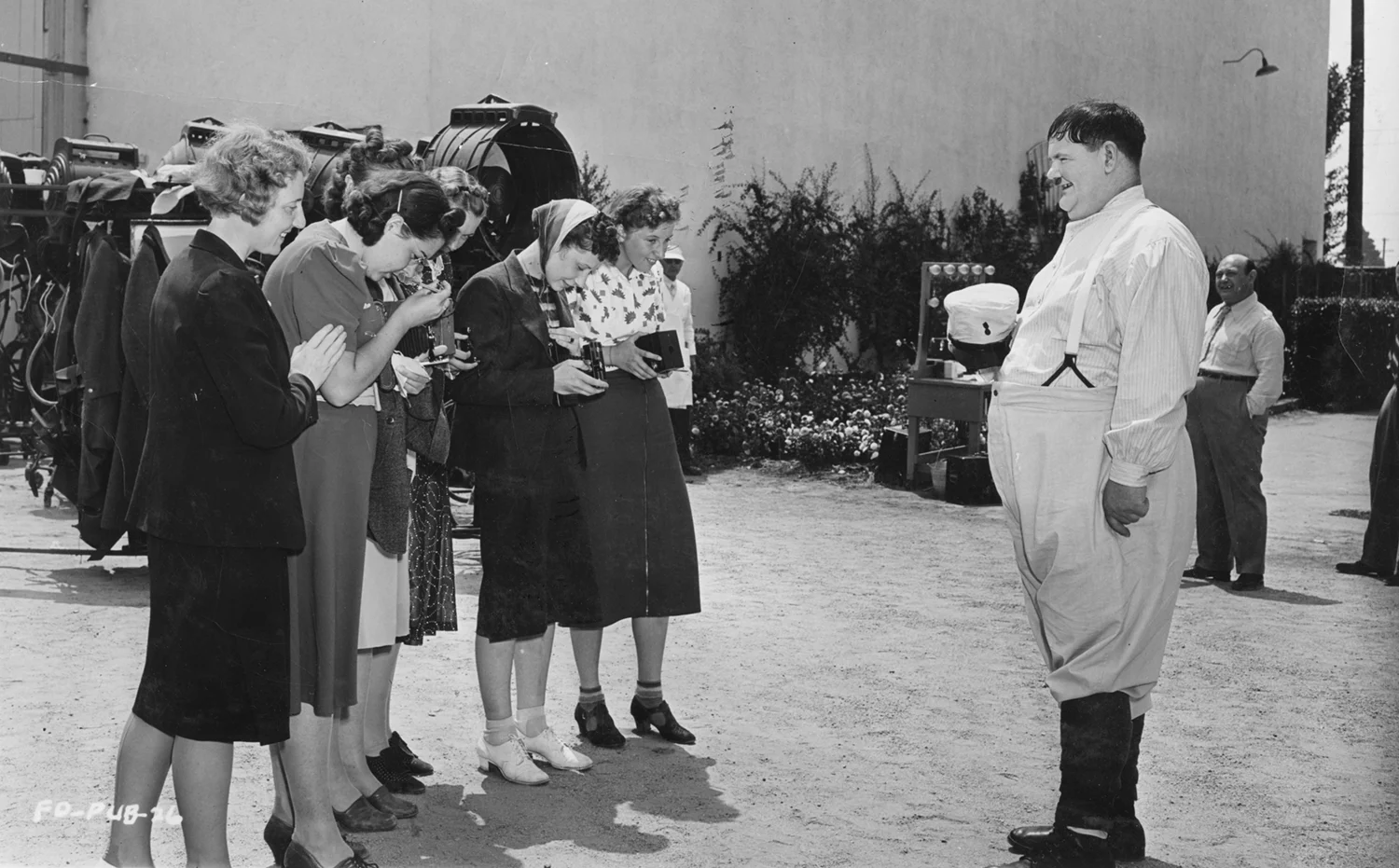 Group of people photographing an actor