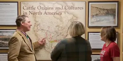 A history professor showing a student a map