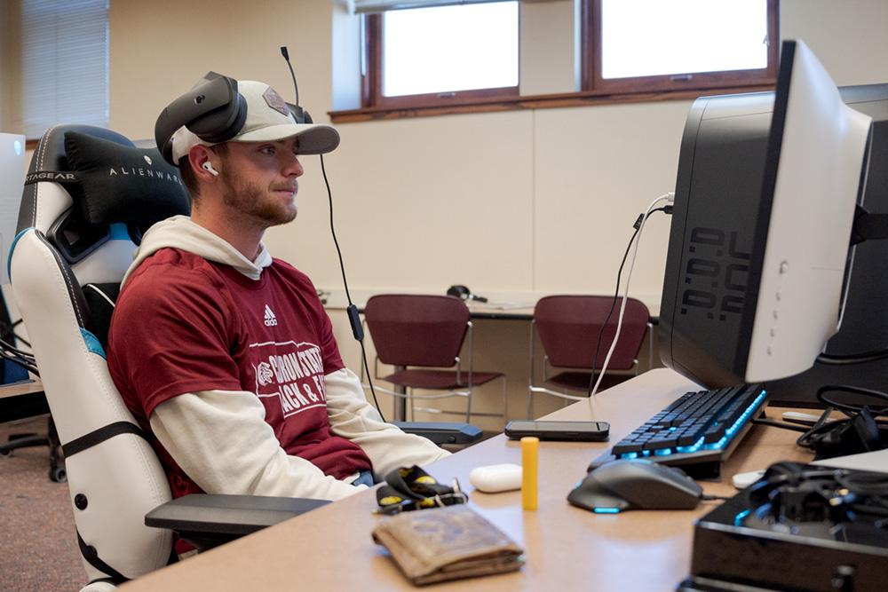 Student playing game at computer