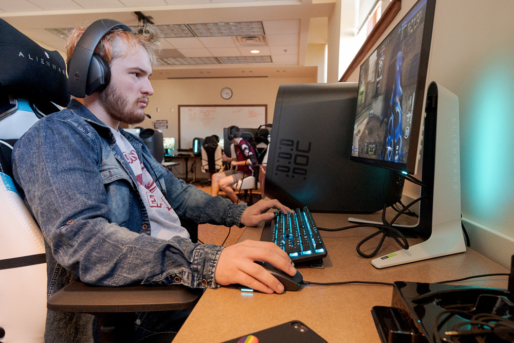 Student playing game at computer