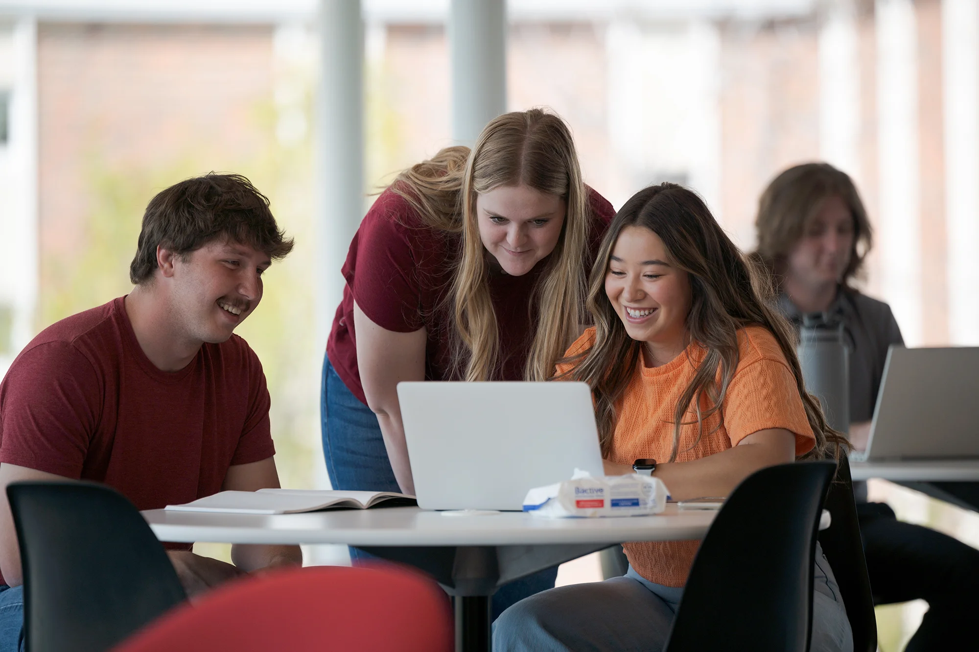 Several students studying in a lounge