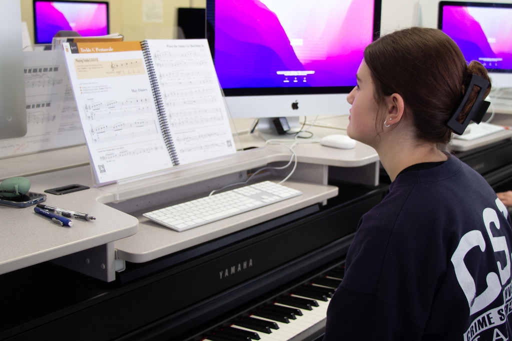student in a keyboard lab