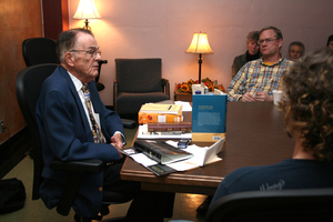 Dr. Dorset Graves, at left, talks about the many books dedicated to Shakespeare during last week's presentation.