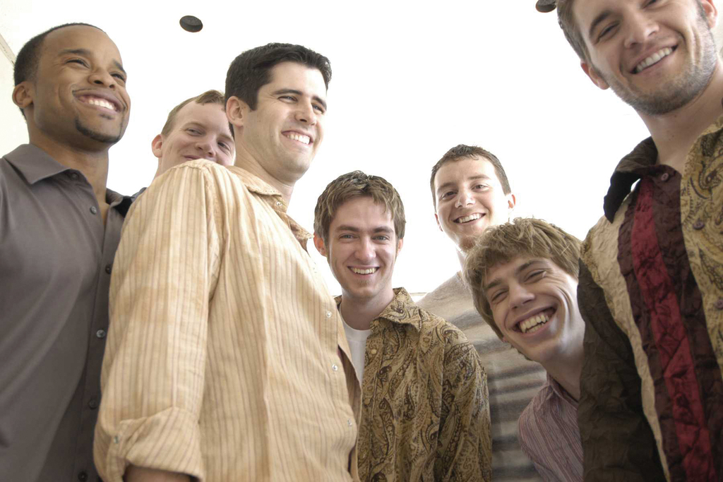 Group of men smiling