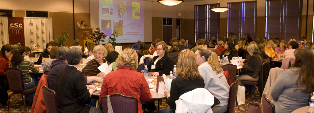 People sit at tables during conference