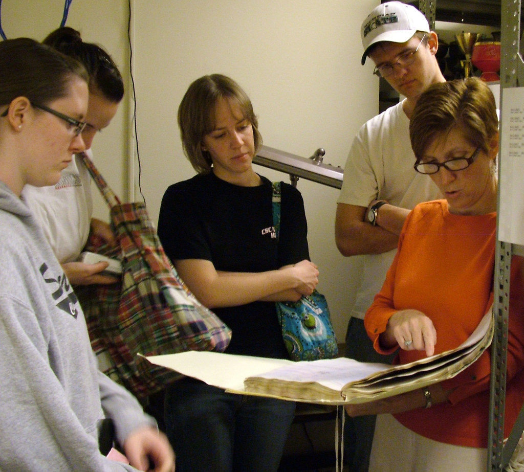 Chadron State College students look over historical documents that were damaged in New Orleans.