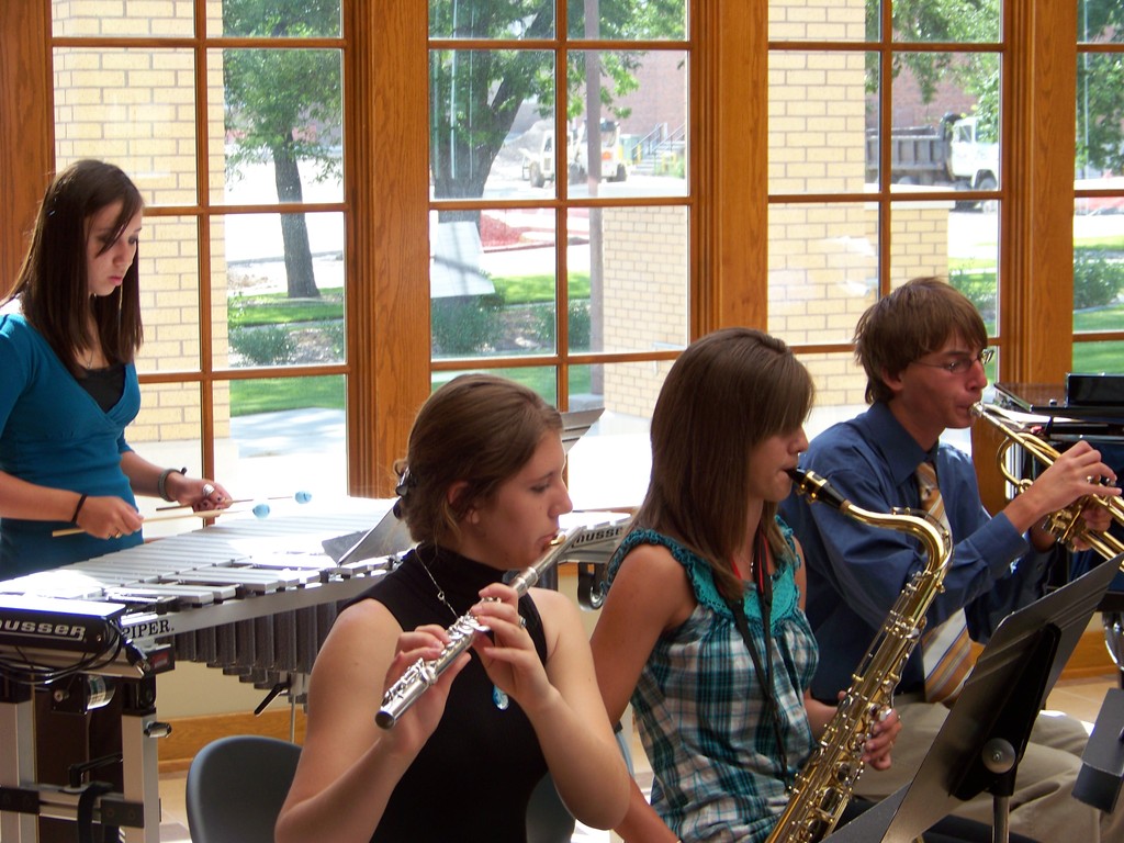 Katie Gutherless, Katie Van Balen, Natasha Teall, and James Safarik play their instruments.