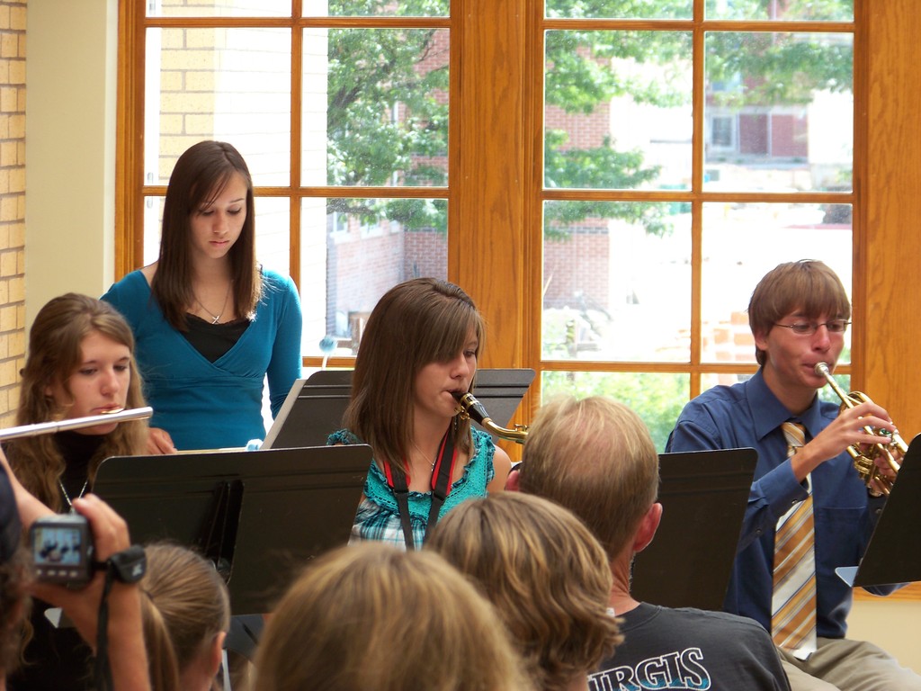 Katie Gutherless, Katie Van Balen, Natasha Teall, and James Safarik play their instruments.