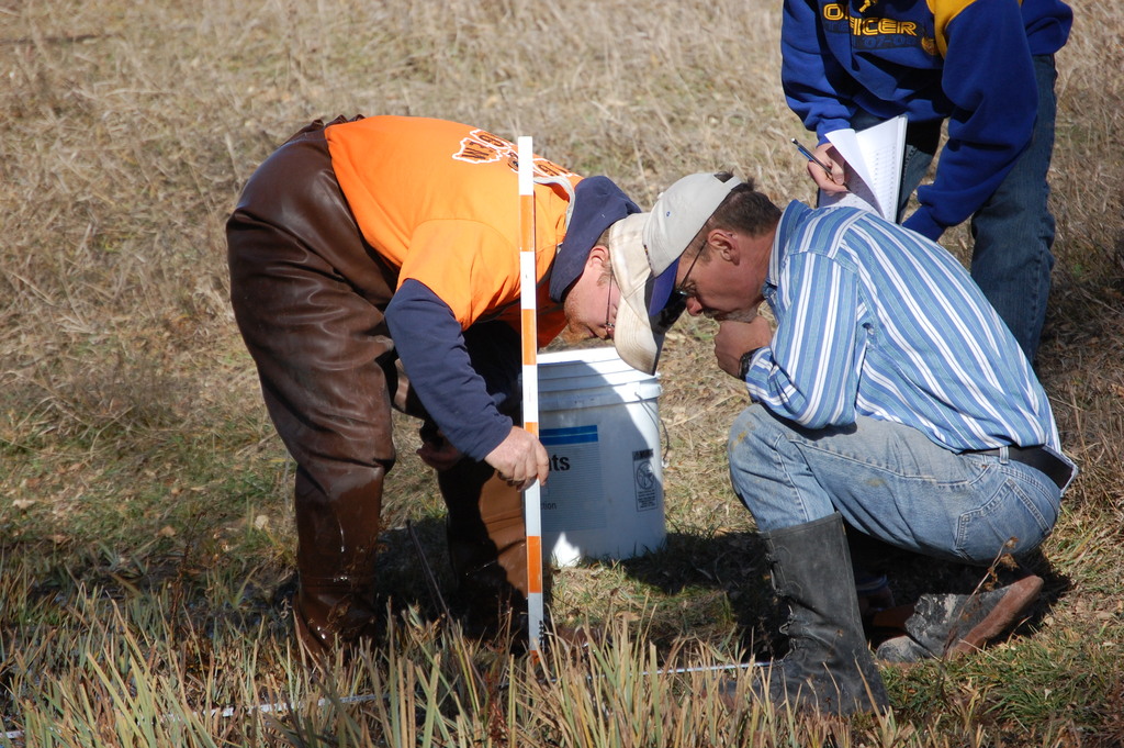 Brice Bultmann, junior, of Yutan, and Dr. Mike Leite, professor of geoscience, conduct stream cross section measurements on Chadron Creek.