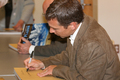 Micheal Forsberg autographs a book
