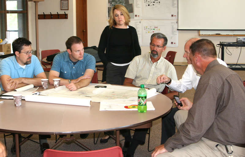 Blair Brennan, Chadron State College coordinator of facilities, at right, meets with architects and designers during the master plan meetings.