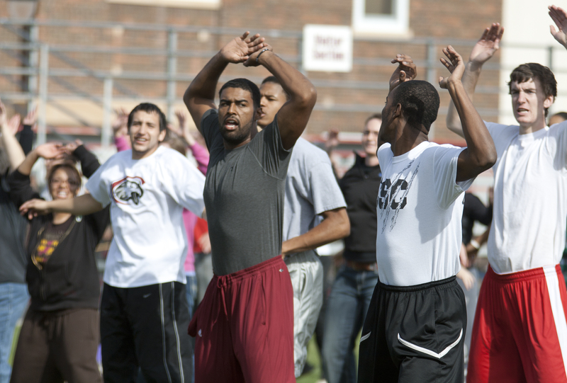 Chadron State College students perform jumping jacks as part of the
