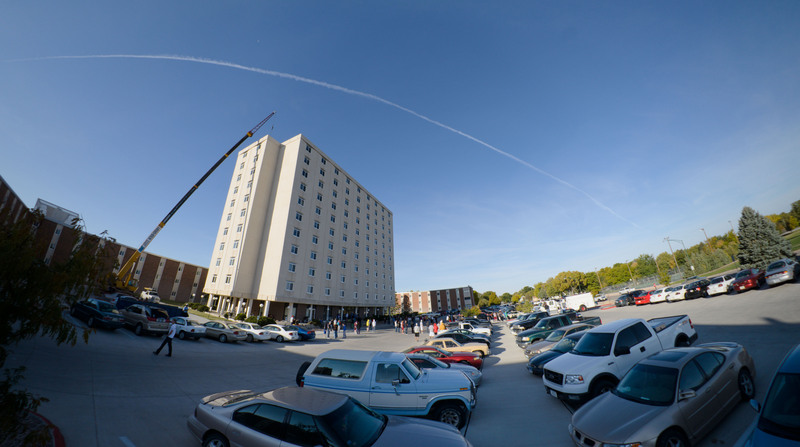 Occupants of the Chadron State College High Rise Residence Hall watch as a fire crew arrives to investigate the cause of an alarm in the building.