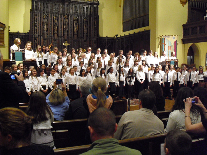 Fifth-graders Abby Hyer, Claire Margetts and Maggie Hughes, lower left, sing in the honor choir.
