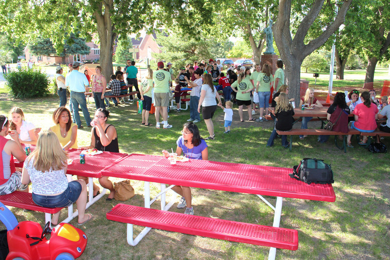 Students and their families gather with staff of the Chadron State College Upward Bound summer program during a picnic at Memorial Park. (Photo by Justin Haag)