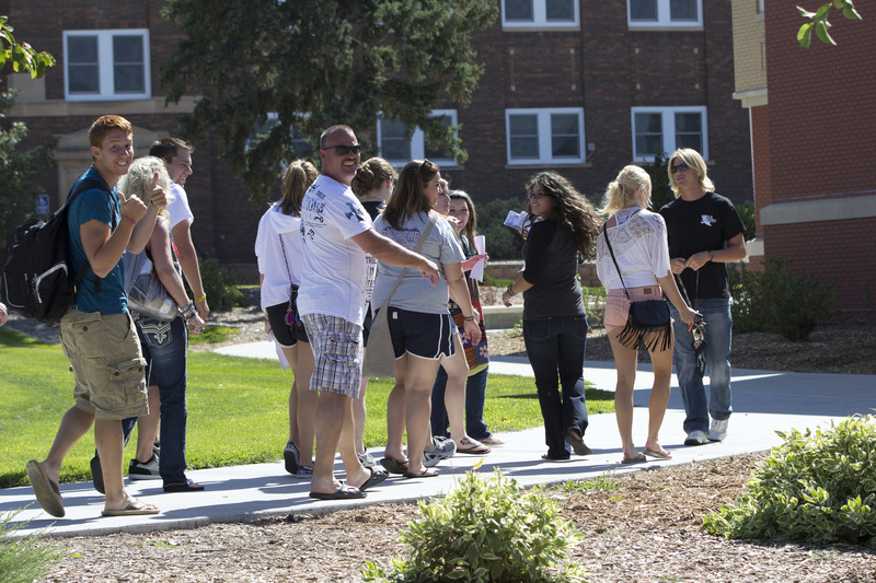 New students spot the cameraman while participating in a campus tour led by Sean Munger of Imperial, at right, on Friday, Aug. 17