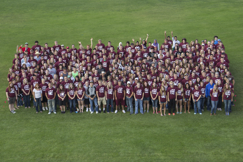 New students of Chadron State College gather for a class photo at Elliott Field on Thursday, Aug. 16