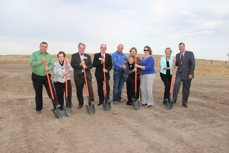 Those close to the Rangeland Complex project gather with shovels for the ceremonial groundbreaking. (Photo by Justin Haag)