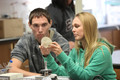 Curtis Perriotte-Olson and Amanda Bown look at plates