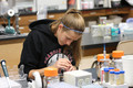 Alexis Hoagland picks a virus from her plate