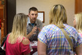 Seth Hulquist assists students on campus