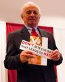 Jack Adler with his book and bumper sticker