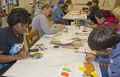 Quentita Green assists in a water color class