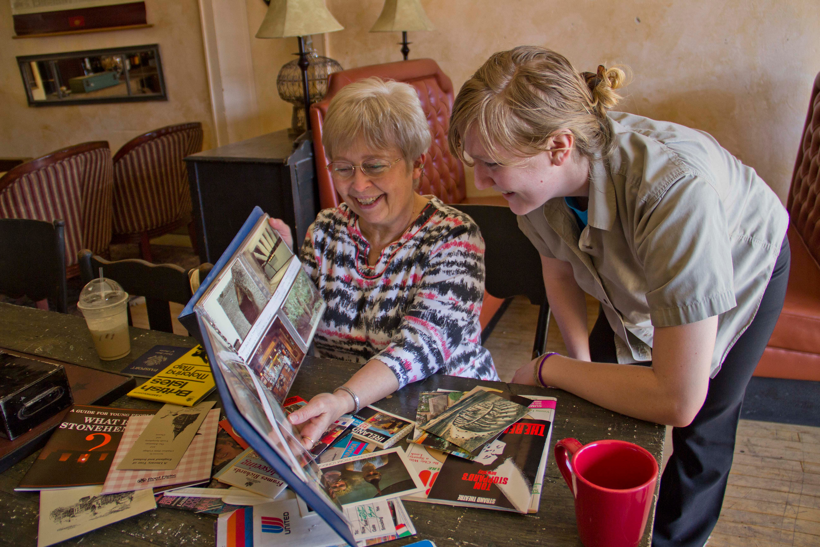 Two women looking at a photo album