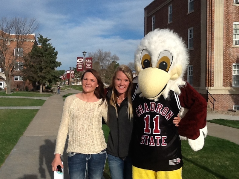 Left to right, incoming Chadron State College student Kate Basler of Akron, Colorado, and her older sister, Chris, pose with Elmo prior to the April 18 Signing Day.