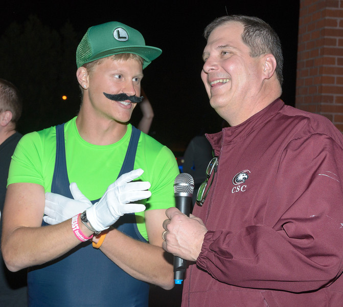Chadron State College President Randy Rhine, right, prepares to start the annual Nearly Naked Mile run with Sean Munger, one of the event organizers, on April 25, 2013.
