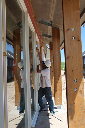 Sampson Construction and subcontractor crews install windows on the south side of the center Eagle Ridge housing unit. Fall room reservations are still being accepted for Chadron State College juniors and seniors. (Tena L. Cook/Chadron State College)