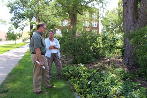 Jim Locklear, left, tours the Heritage Gardens near the Sandoz Center with CSC horticulturist Lucinda Mays, right, Friday. (Tena L. Cook/Chadron State College)