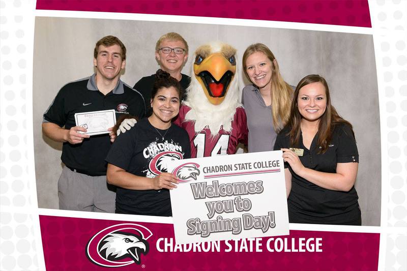 Students and faculty pose with Elmo the eagle at CSC Signing Day.