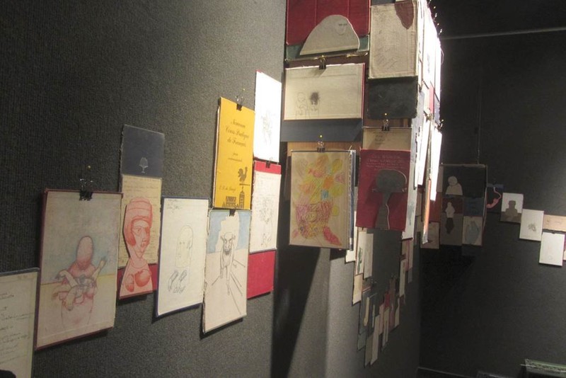 Parts of old books are mounted in undulating shapes on the walls of Memorial Hall.
