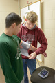 Logan Zeiler takes student's blood pressure