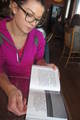 Mackenzie Swanson examines a book she created