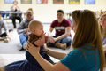 A woman holding a baby