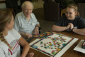 Two students visit with Don Housh