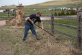 Craig Phillips rakes the grass