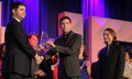 Troy Fields and Drew Kasch receive the ninth place trophy
