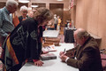 Dr. Paul Hutton autographs his books