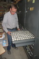 Mike Leite examines a drawer fossil