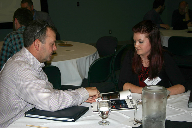 Chadron State College student Tara Medigovich of San Luis Obispo, Calif., right, meets with an advertising professional during the American Advertising Federation's Meet the Pros event in Omaha Feb. 20-21, 2017.