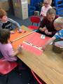 Teacher assists with tallying votes