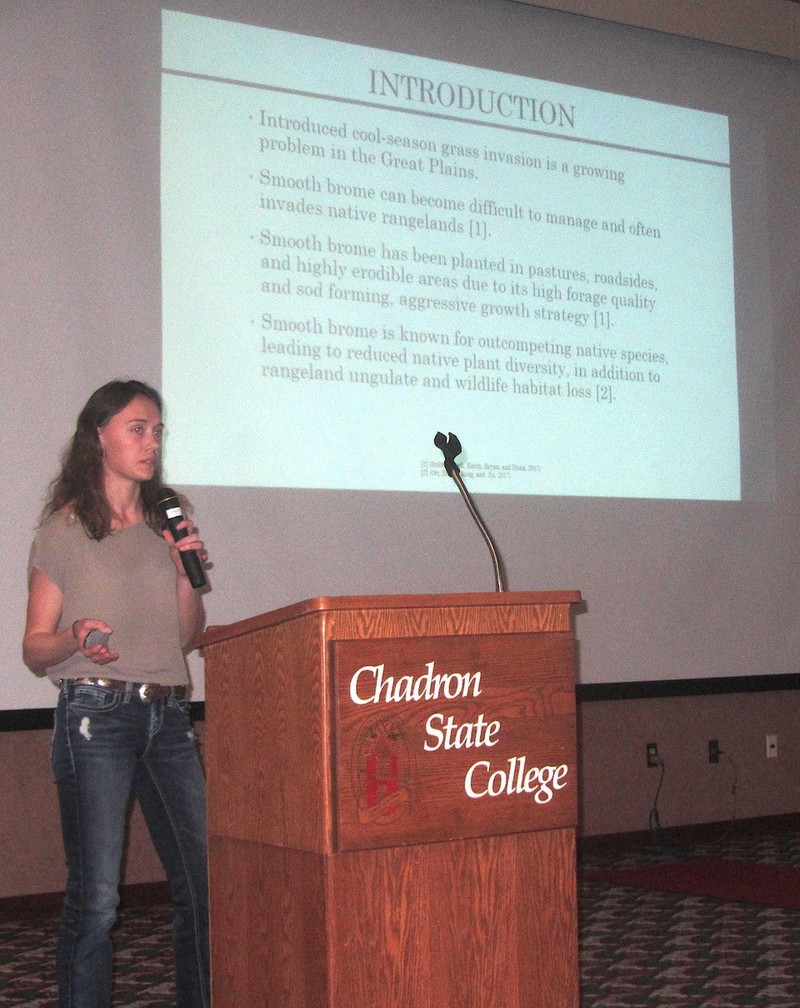 Chadron State College Rangeland Management program student Vanessa Yeoman of Hot Springs, S.D., explains her research project into methods for control of smooth brome during Range Day at the CSC Student Center Jan. 19, 2019.