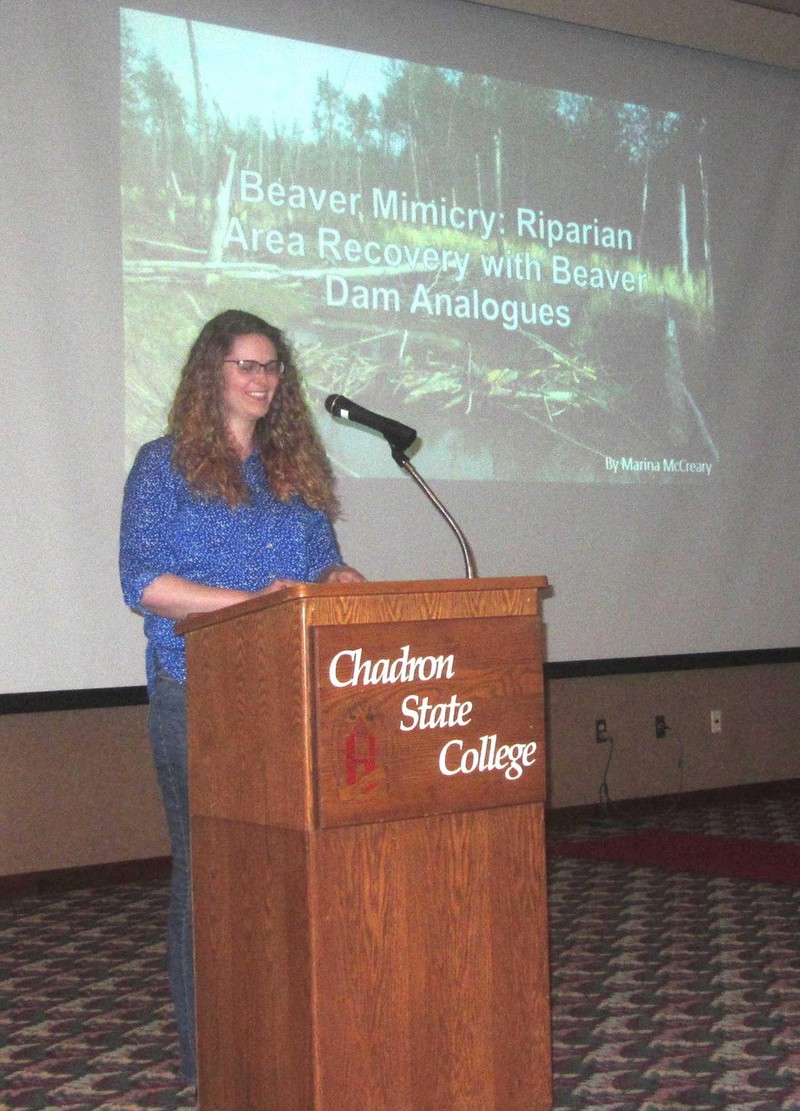 Chadron State College Rangeland Management program student Marina McCreary of Morrill, Neb., speaks at Range Day about her research into use of beaver dam analogues to improve riparian habitat and plant diversity.