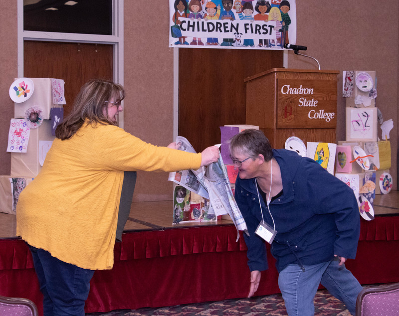 Jennifer Baumann of Chadron, left, and Colleen Timm of Scottsbluff take part in an exercise demonstrating a healthy way for pre-school children to express their anger Saturday, Feb. 16, 2019, in the Student Center. (Tena L. Cook/Chadron State College)
