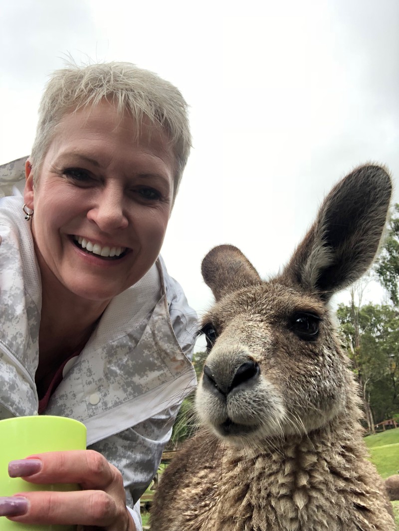 Chadron State College Professor Dr. Tracy Nobiling takes a selfie with a kangaroo in the Currumbin Wildlife Sanctuary in Queensland, Australia. (Courtesy Photo)