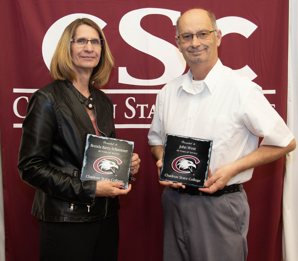 Chadron State College employees Brenda Barry-Schommer and John West (CSC Dining Services), 40 years of service, pose at the annual CSC recognition luncheon.